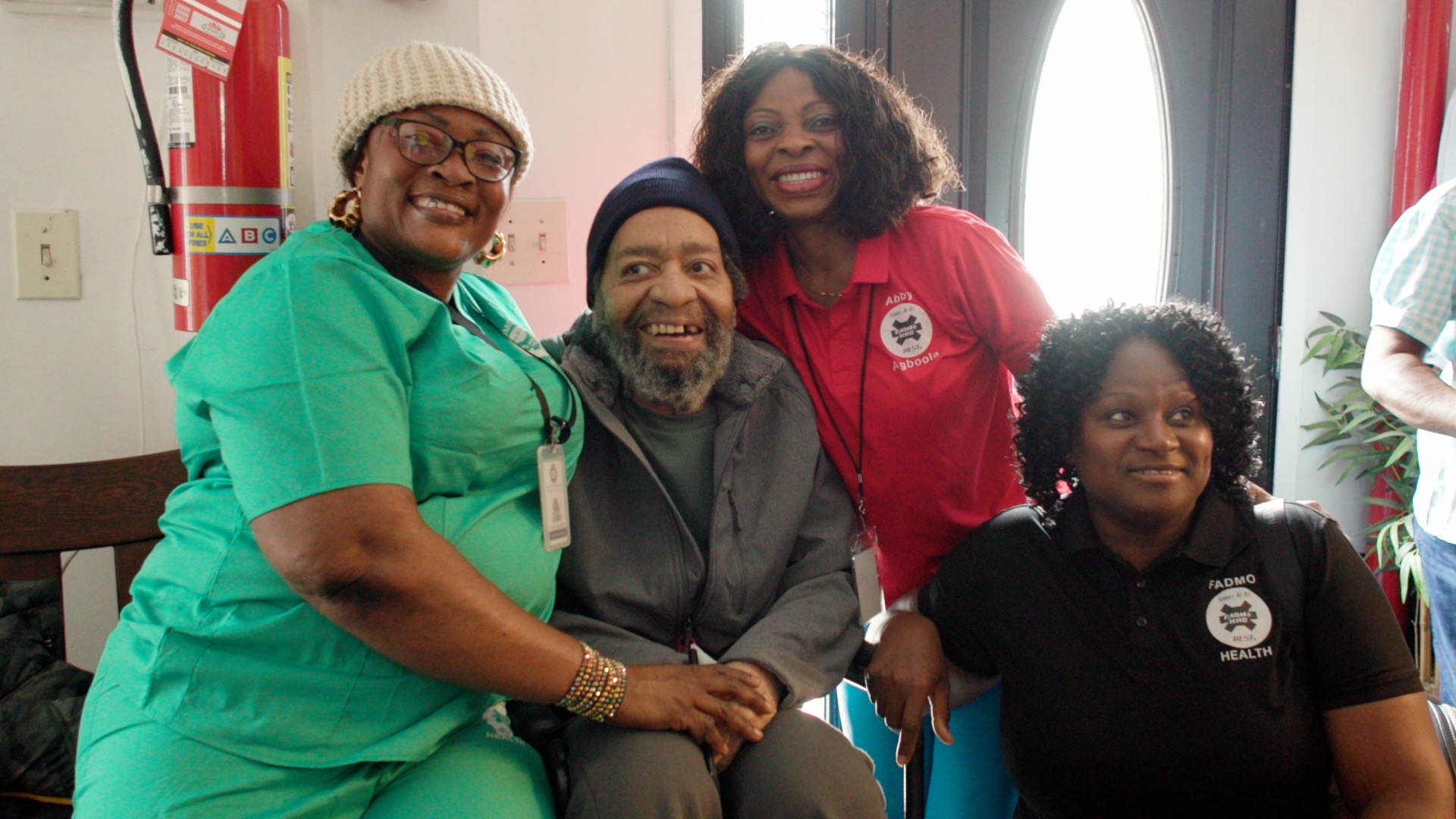 Fadmo caregivers, including Nurse Abby Agboola, sharing a joyful moment with a client